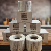 "Waterproof food date label sticker roll"
"Food date labels being applied to container"
"Close-up of easy-peel food date sticker"
"Pack of food date label rolls"