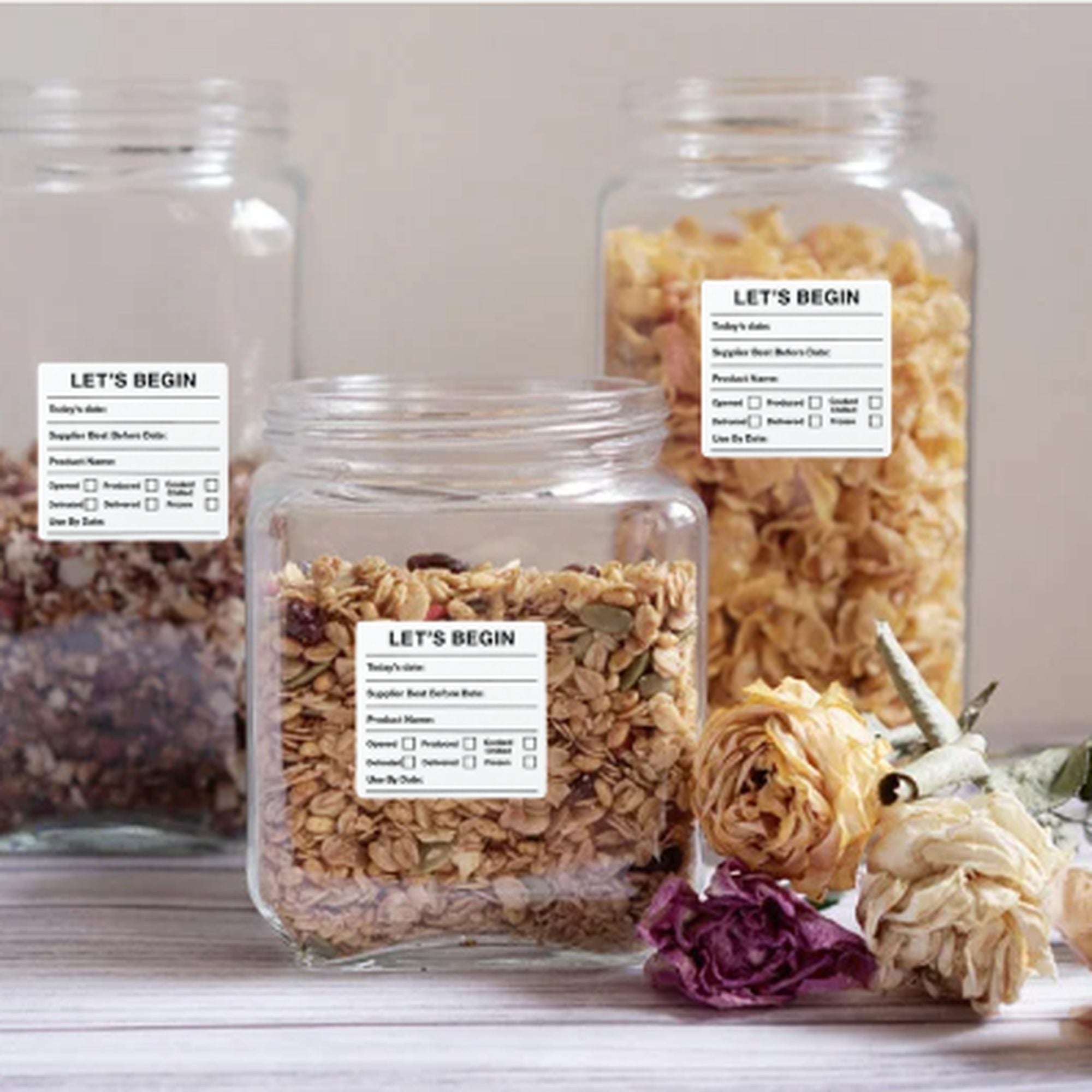 "Waterproof food date label sticker roll"
"Food date labels being applied to container"
"Close-up of easy-peel food date sticker"
"Pack of food date label rolls"