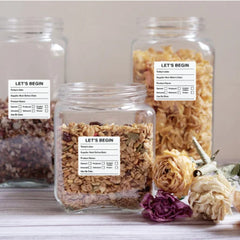 "Waterproof food date label sticker roll"
"Food date labels being applied to container"
"Close-up of easy-peel food date sticker"
"Pack of food date label rolls"