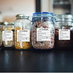 "Waterproof food date label sticker roll"
"Food date labels being applied to container"
"Close-up of easy-peel food date sticker"
"Pack of food date label rolls"