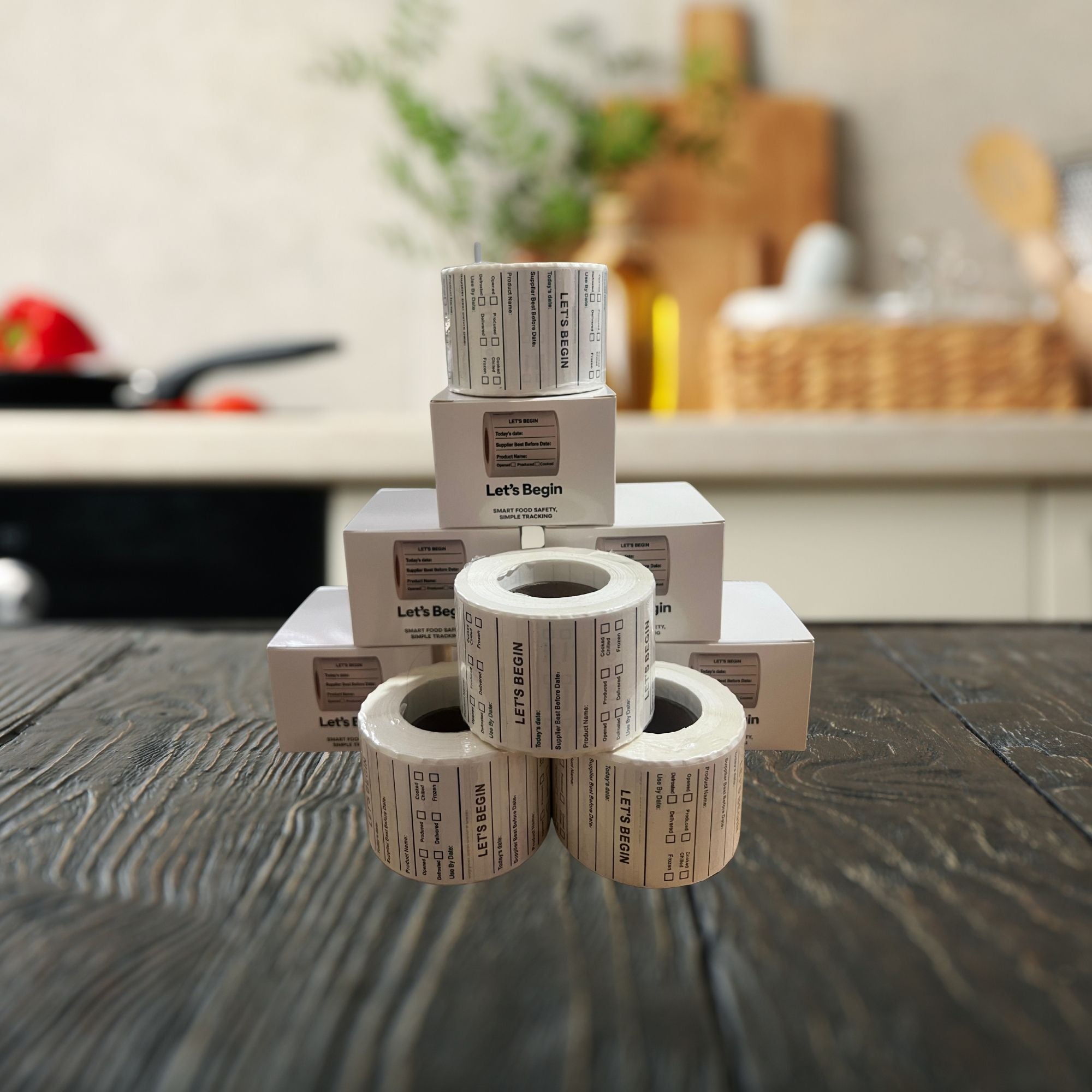 "Waterproof food date label sticker roll"
"Food date labels being applied to container"
"Close-up of easy-peel food date sticker"
"Pack of food date label rolls"